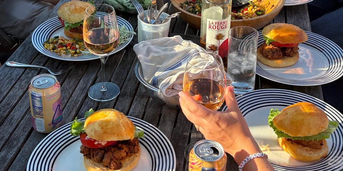 I hosted a dinner party every Saturday in 2025. My husband and I made new friends, ate good food, and got the kids to bed on time. - Featured Image