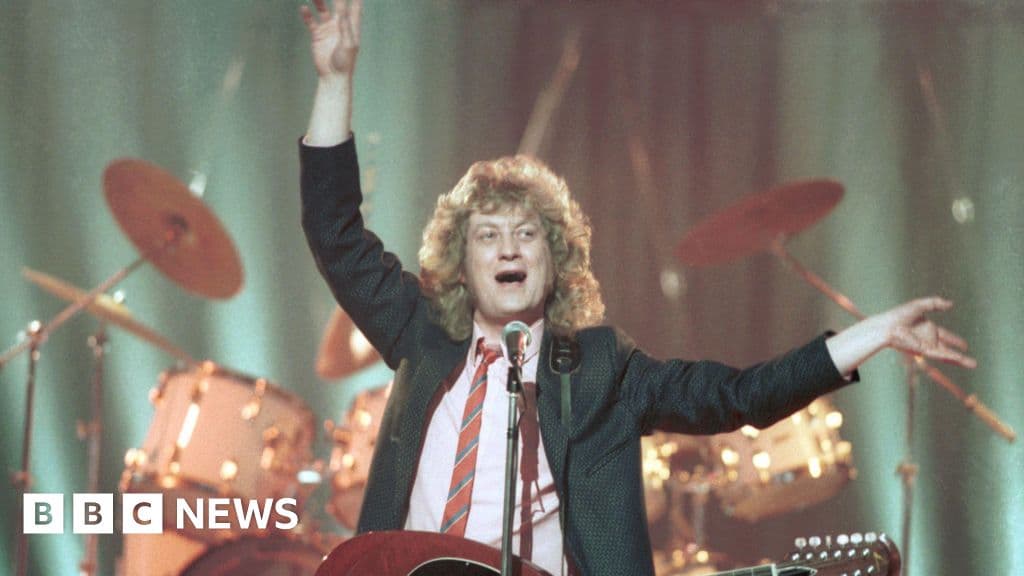 Noddy Holder 'avoids restaurants on Christmas' due to Slade song - BBC News - Featured Image