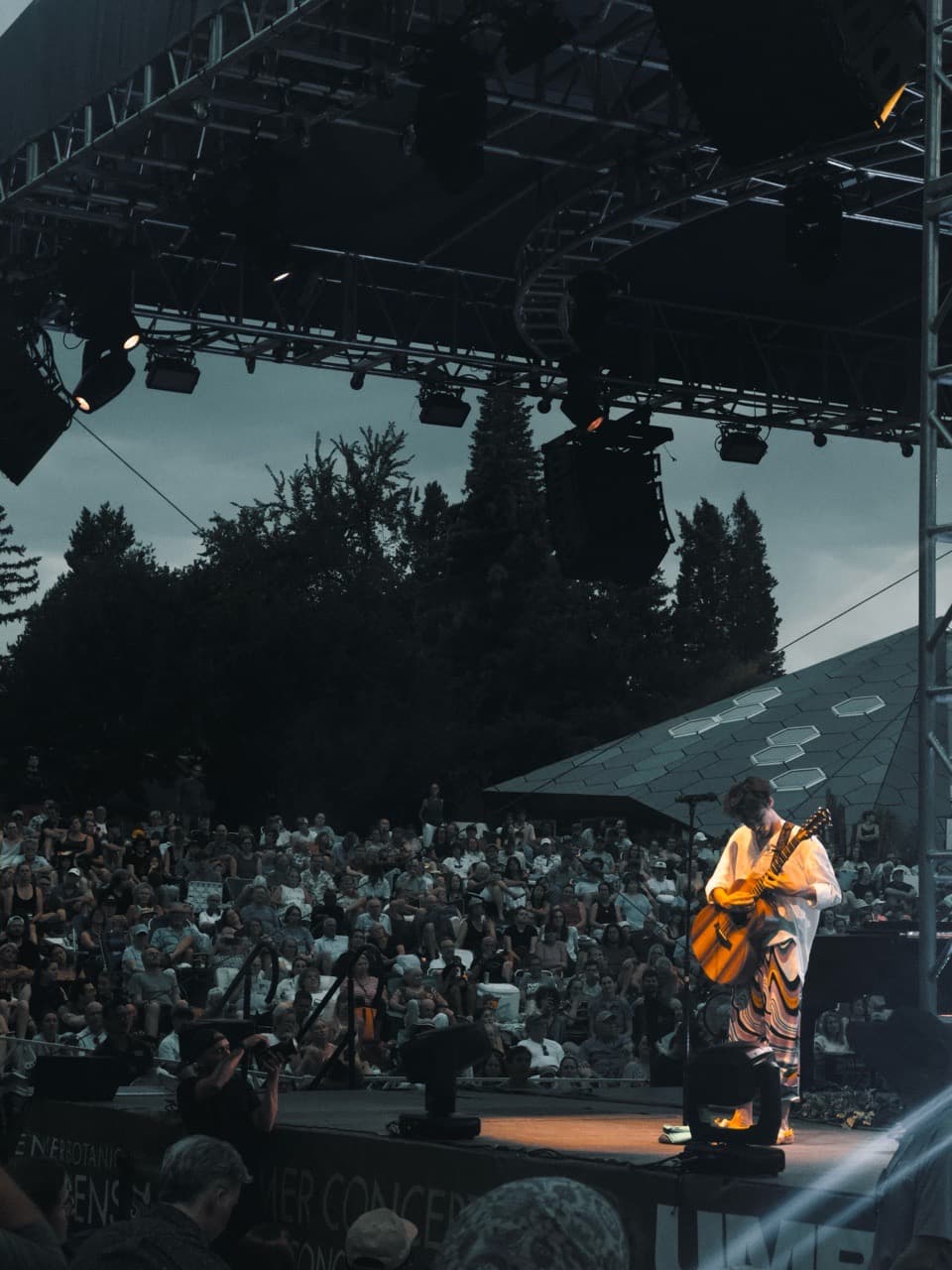 Jacob Collier playing guitar on stage. Image credit: Sean Patrick John Paul George Ringo Doran / Summer, 2025