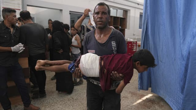 74 killed in Gaza as Israeli forces strike a cafe and fire on people seeking food - Featured Image