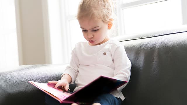 Nearly a third of kids can't use books when starting school - and try to swipe them like phones | UK News | Sky News - Featured Image